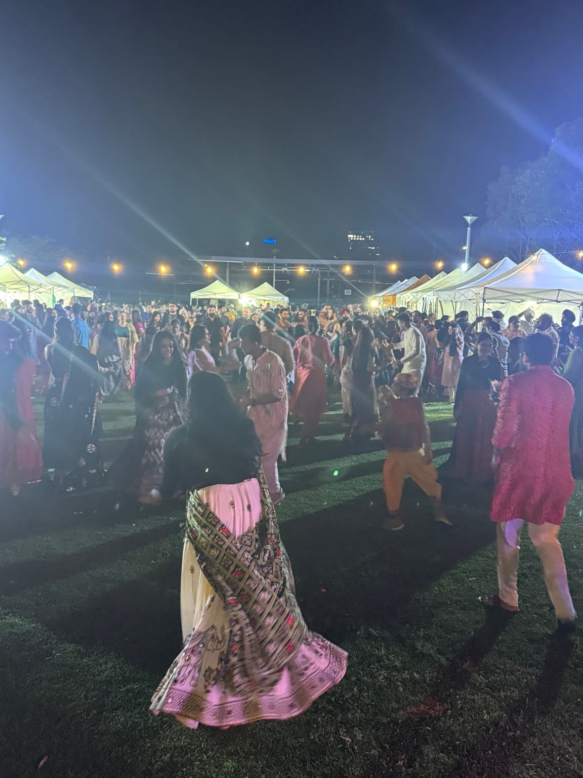Garba dancers celebrating in the open air