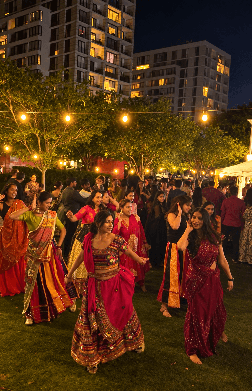 Garba dancers enjoying the night beneath warm string lights